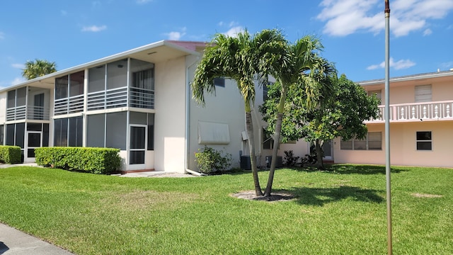 view of building exterior featuring central AC