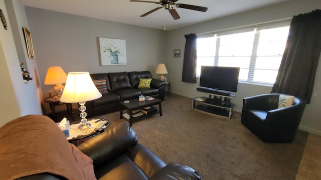 carpeted living room with ceiling fan