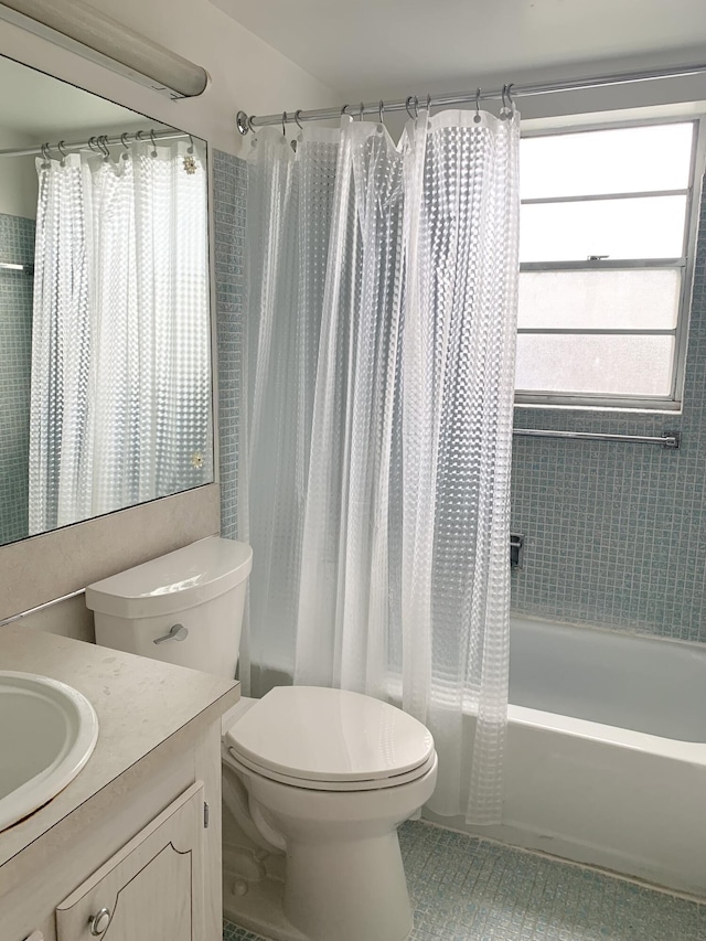 full bathroom with toilet, vanity, tile patterned floors, and shower / bath combo