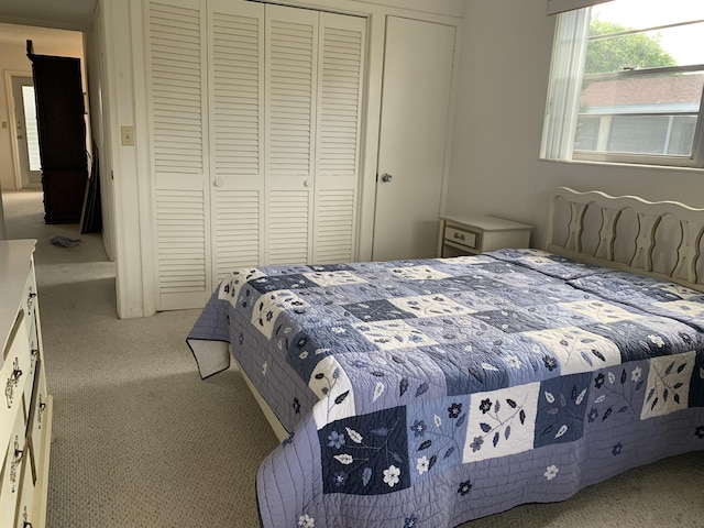 carpeted bedroom featuring a closet