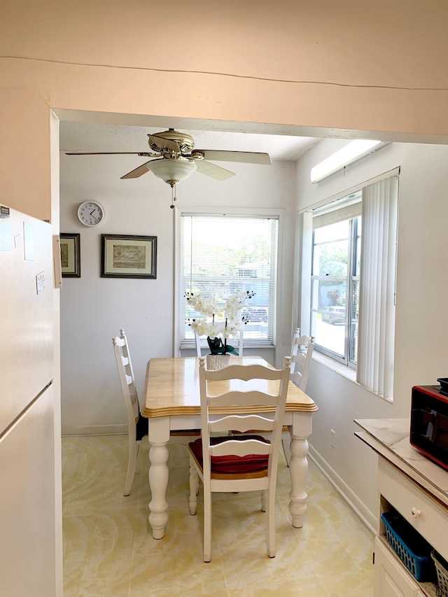 dining room with ceiling fan