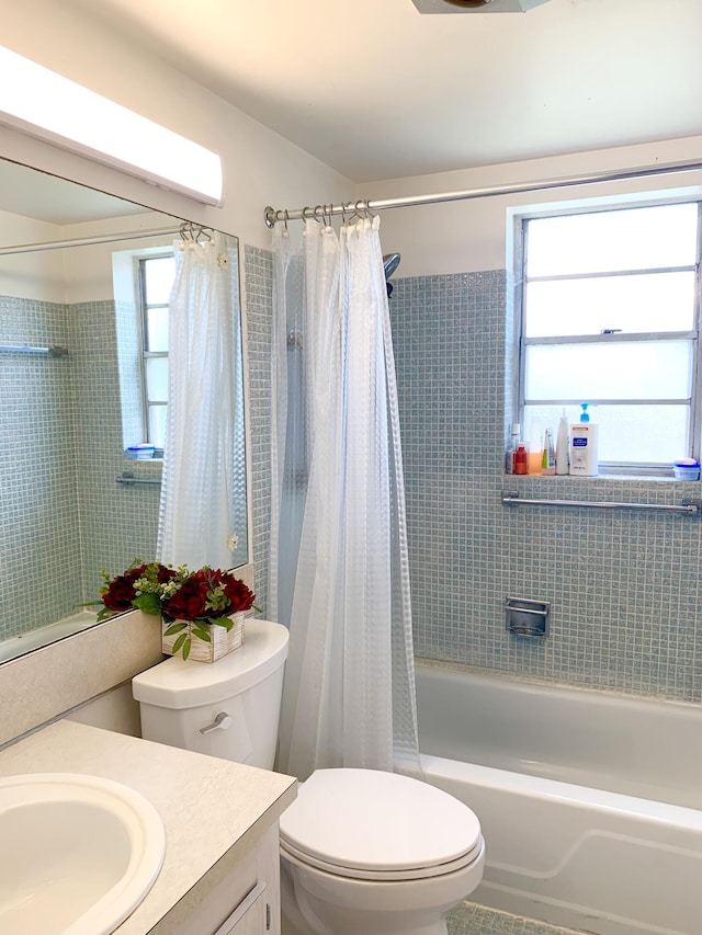 full bathroom with toilet, tile patterned flooring, shower / bath combo, and vanity