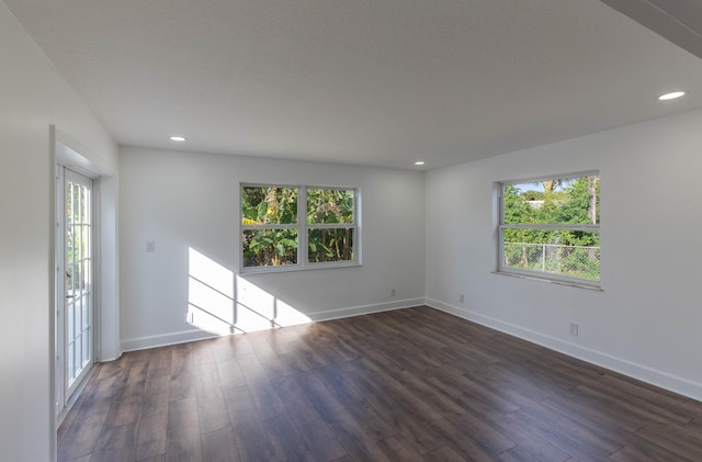 spare room featuring dark hardwood / wood-style floors