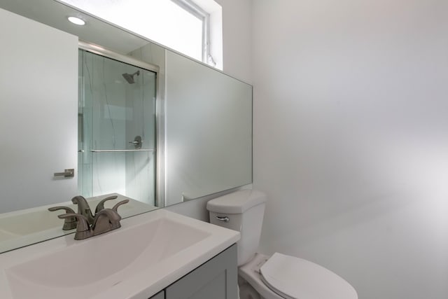 bathroom with toilet and vanity