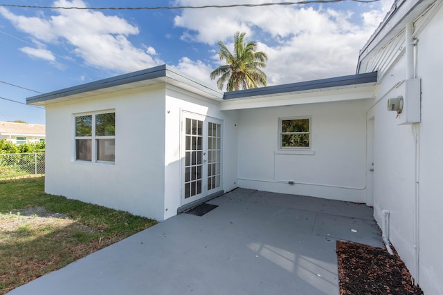 entrance to property with a patio