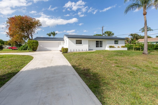 ranch-style house with a front yard and a garage