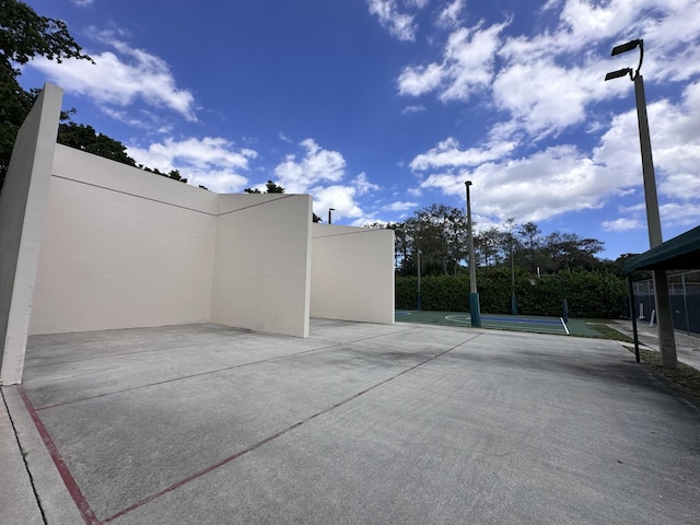 view of patio / terrace featuring tennis court