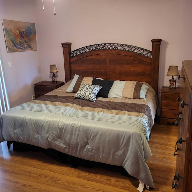 bedroom with hardwood / wood-style floors