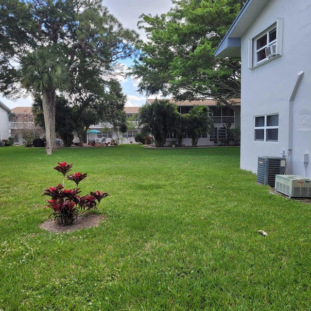 view of yard with central air condition unit