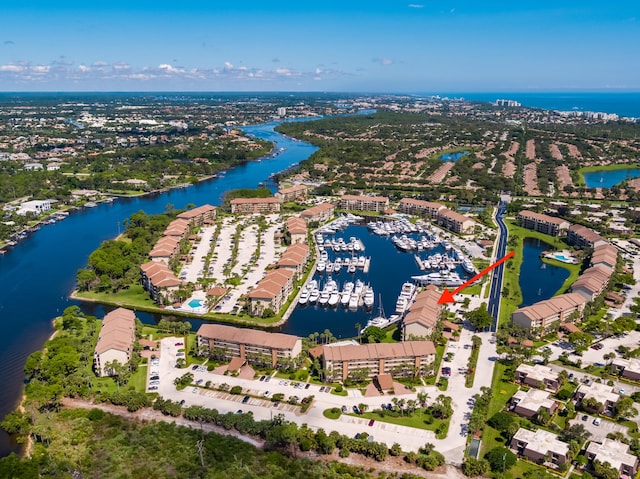 birds eye view of property with a water view