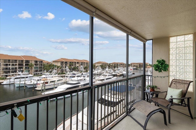 balcony featuring a water view