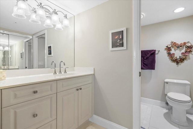 bathroom featuring tile floors, oversized vanity, and toilet