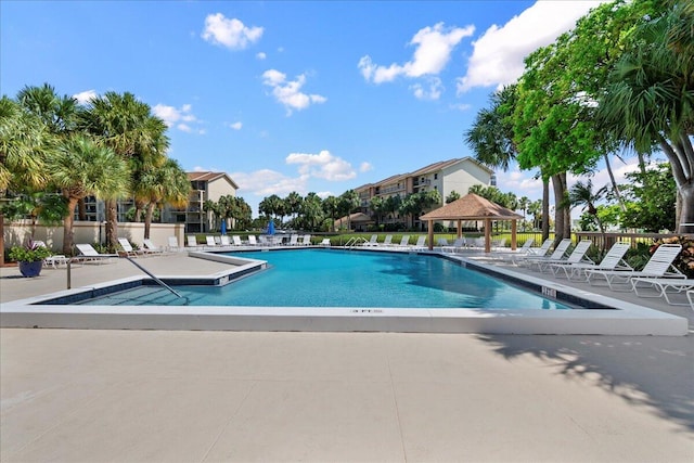 view of swimming pool with a gazebo and a patio area