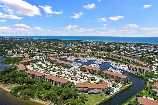 birds eye view of property with a water view