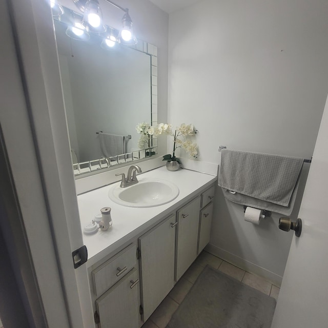 bathroom featuring vanity and tile flooring