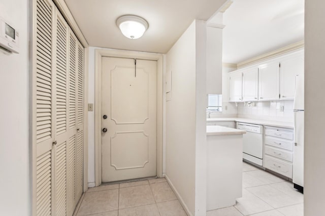 doorway with light tile floors