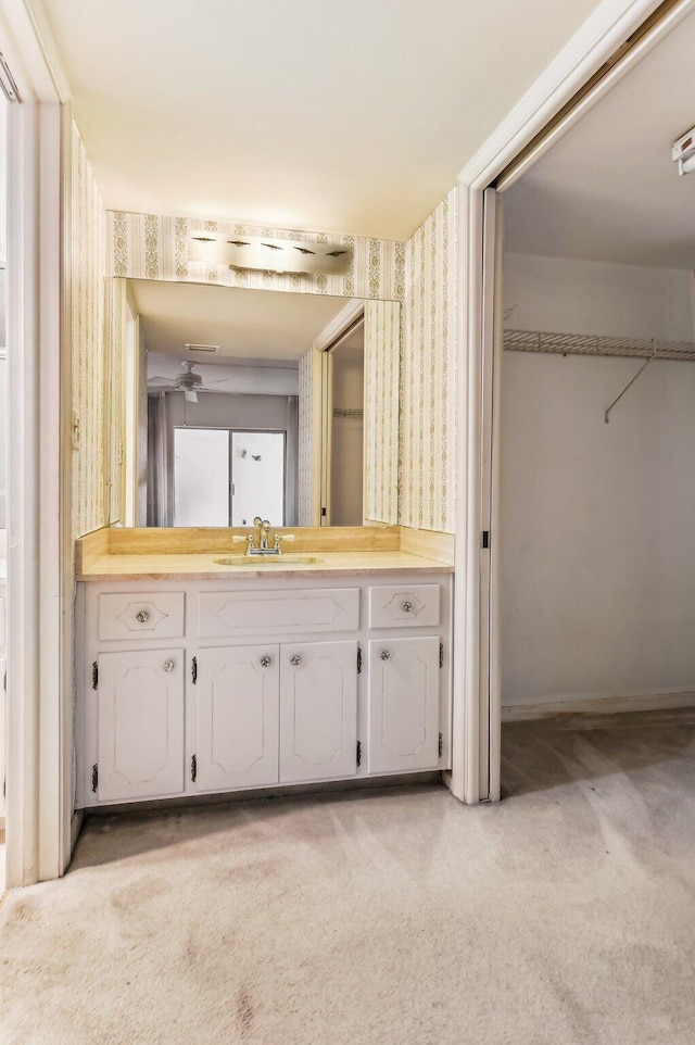 bathroom featuring vanity and ceiling fan