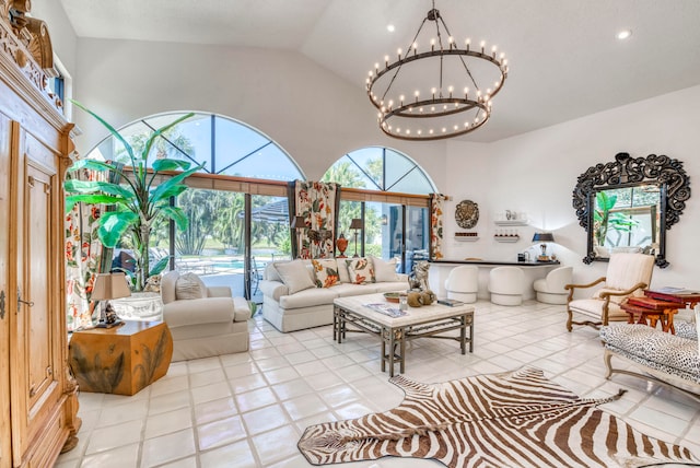 living room featuring high vaulted ceiling, a notable chandelier, and light tile floors