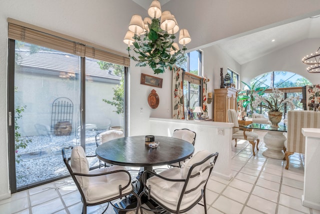 tiled dining room featuring lofted ceiling and a chandelier