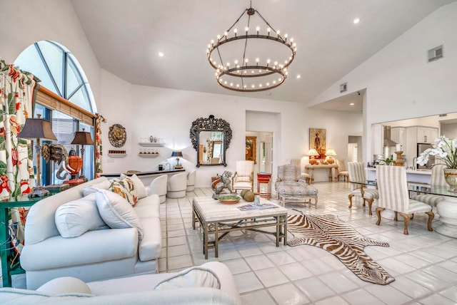 tiled living room featuring a chandelier and high vaulted ceiling