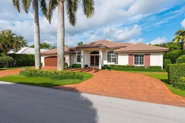 mediterranean / spanish-style house featuring a garage