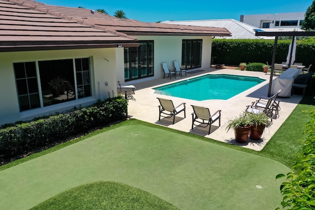 view of pool featuring a patio