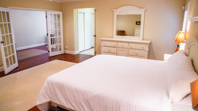 bedroom featuring dark hardwood / wood-style floors and french doors