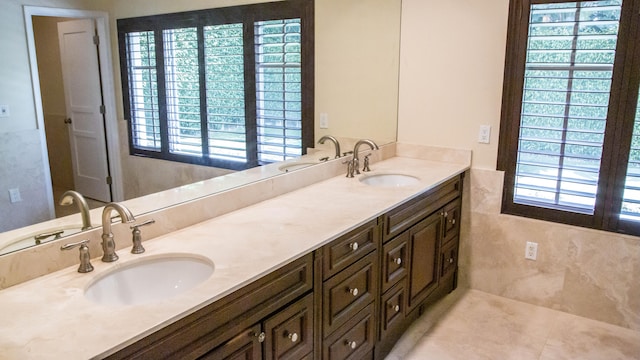 bathroom with double sink vanity and tile flooring