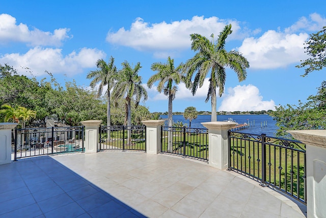 view of patio featuring a water view