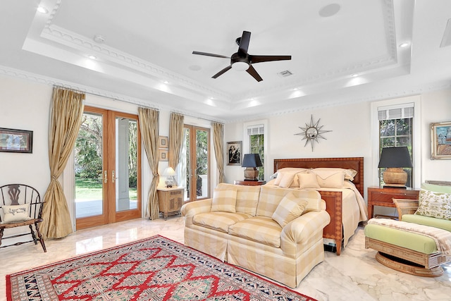 tiled living room featuring french doors, crown molding, ceiling fan, and a tray ceiling