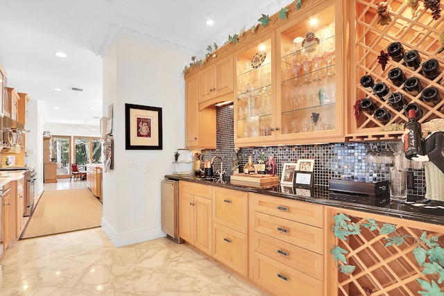 kitchen featuring tasteful backsplash, sink, and light tile flooring