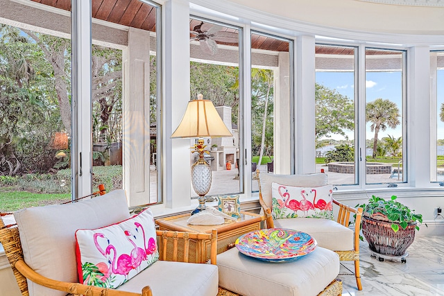 sunroom / solarium with ceiling fan