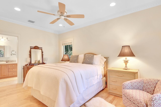 bedroom featuring ensuite bathroom, ceiling fan, crown molding, and light wood-type flooring