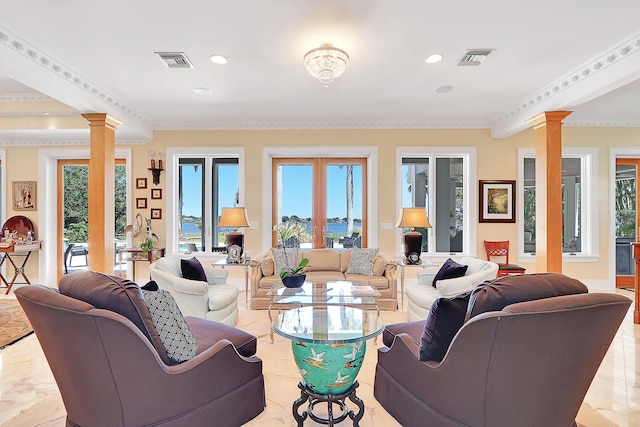 tiled living room featuring ornamental molding, a healthy amount of sunlight, and decorative columns