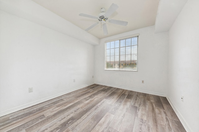 empty room featuring light hardwood / wood-style flooring and ceiling fan