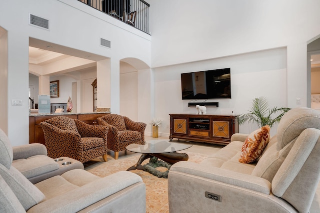 living room with a high ceiling