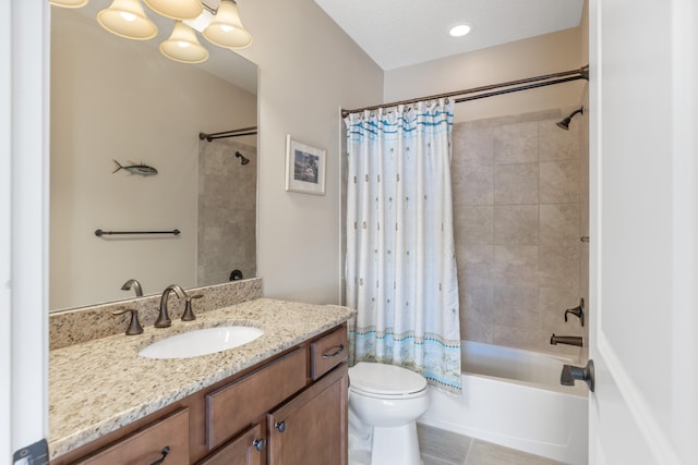 full bathroom featuring shower / bath combo with shower curtain, a chandelier, vanity, tile patterned floors, and toilet