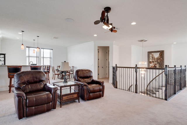 carpeted living room with a notable chandelier and a textured ceiling