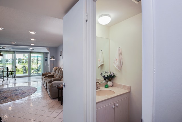 bathroom featuring tile floors and vanity