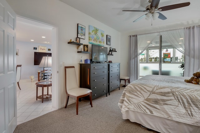 bedroom with light tile flooring, access to exterior, and ceiling fan