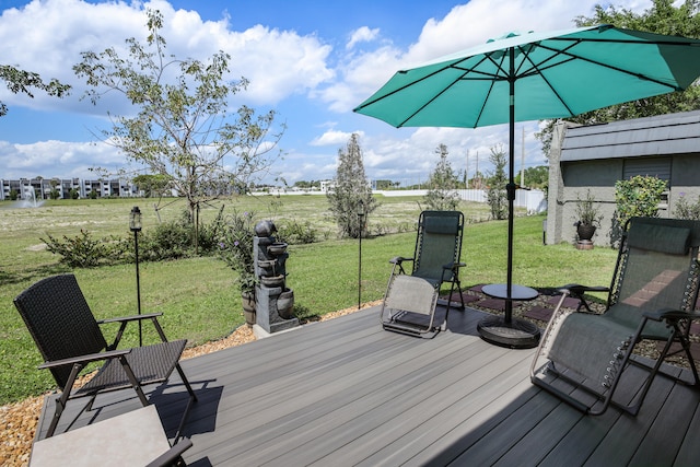 wooden deck with a lawn