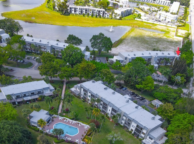 birds eye view of property with a water view