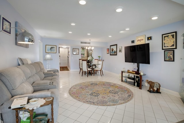 tiled living room featuring a notable chandelier