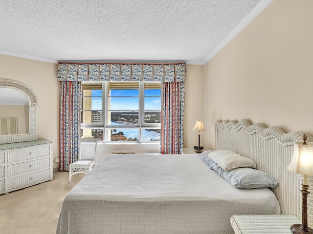 carpeted bedroom featuring crown molding and a textured ceiling