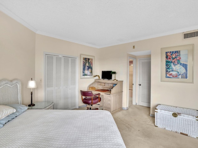 bedroom featuring a closet, ornamental molding, a textured ceiling, and light colored carpet