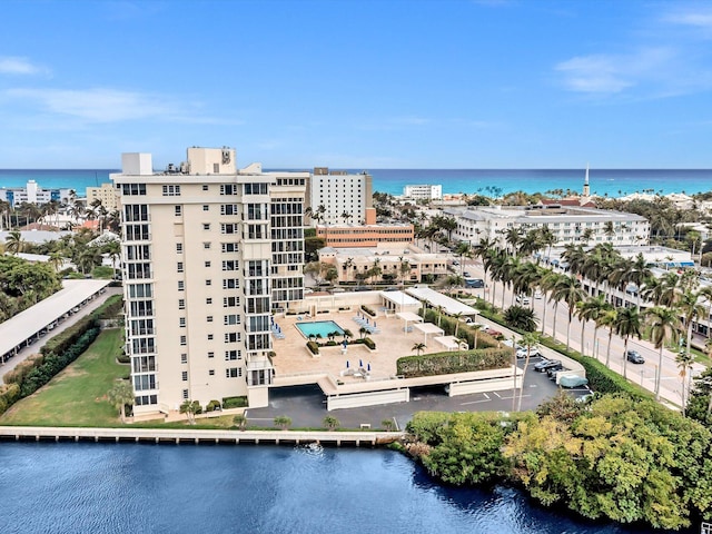 birds eye view of property with a water view