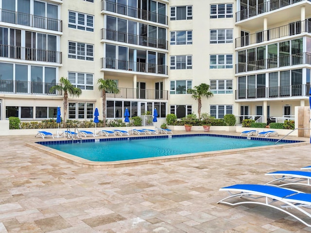 view of pool featuring a patio