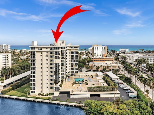 birds eye view of property featuring a water view