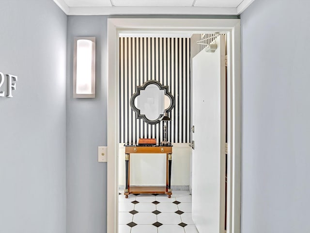 hallway featuring light tile flooring