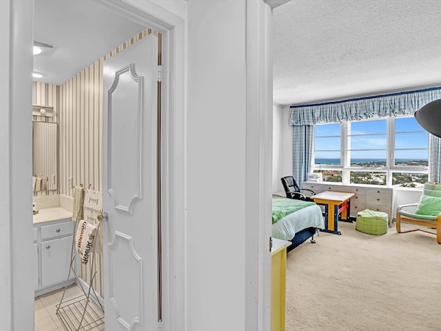 carpeted bedroom with a textured ceiling